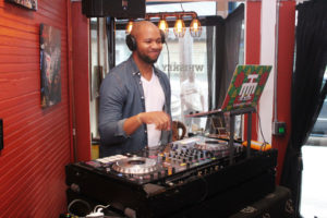 DJ RQ Away DJing at Ashley Lorraine's 'Faces of Zulu' Exhibit